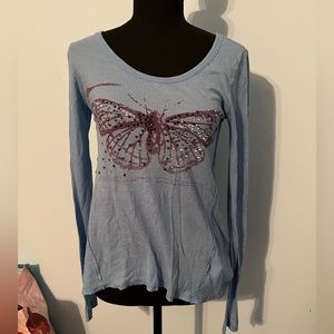 Long sleeve light blue shirt with butterfly design